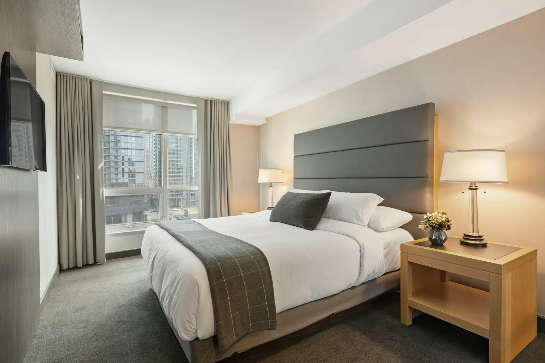 Point3D Commercial Imaging Ltd. / Unsplash Crisp hotel bed linen folded to a quiet, even finish — editorial still
